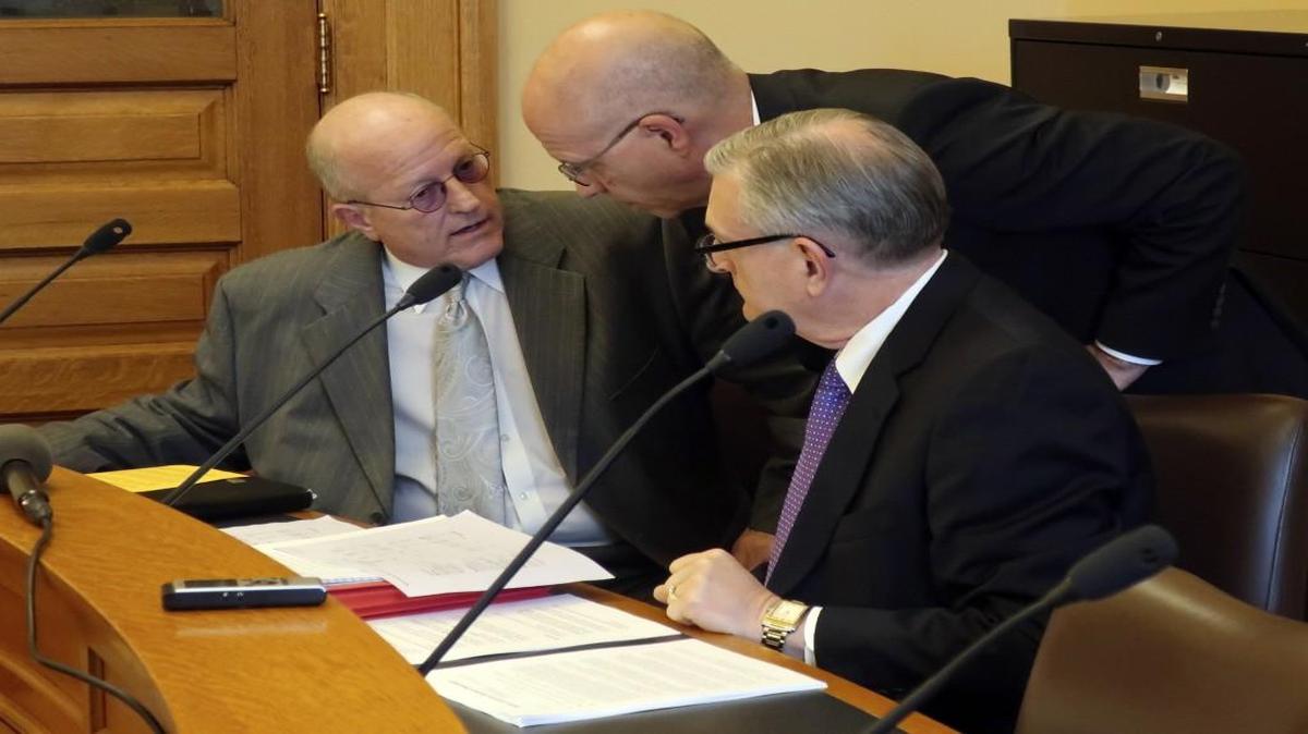 Larry Campell (left), Kansas Gov. Jeff Colyer’s budget director, conferred with J.G. Scott (center), the Legislature’s top fiscal analyst, and Raney Gilliland, the director of the Legislature’s research staff, before the release of a new fiscal forecast Friday at the Statehouse in Topeka.