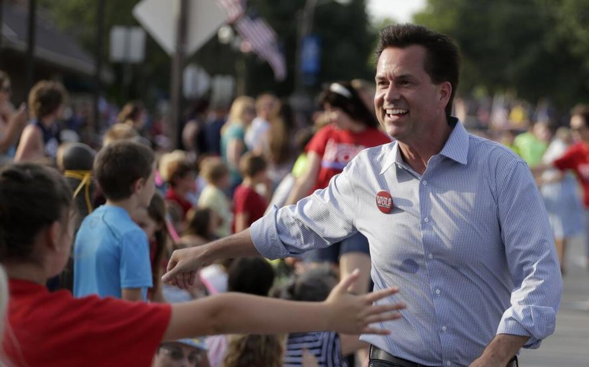 
Milton Wolf worked the crowd at a Fourth of July parade in Wamego, Kan., during his unsuccessful campaign challenging U.S. Sen. Pat Roberts. Wolf now says he’ll return to Wamego for Monday’s appearance by U.S. Sen. Jerry Moran. 
