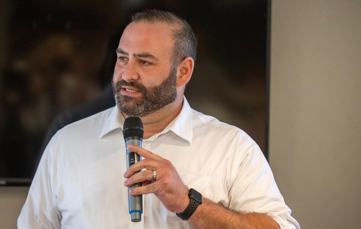 iRepresentative Adam Schwadron, a Republican, who is a candidate for Missouri Secretary of State, speaks to members of the Jackson County Republican Party during an ice cream social in Kansas City on Sunday, July 14, 2024.