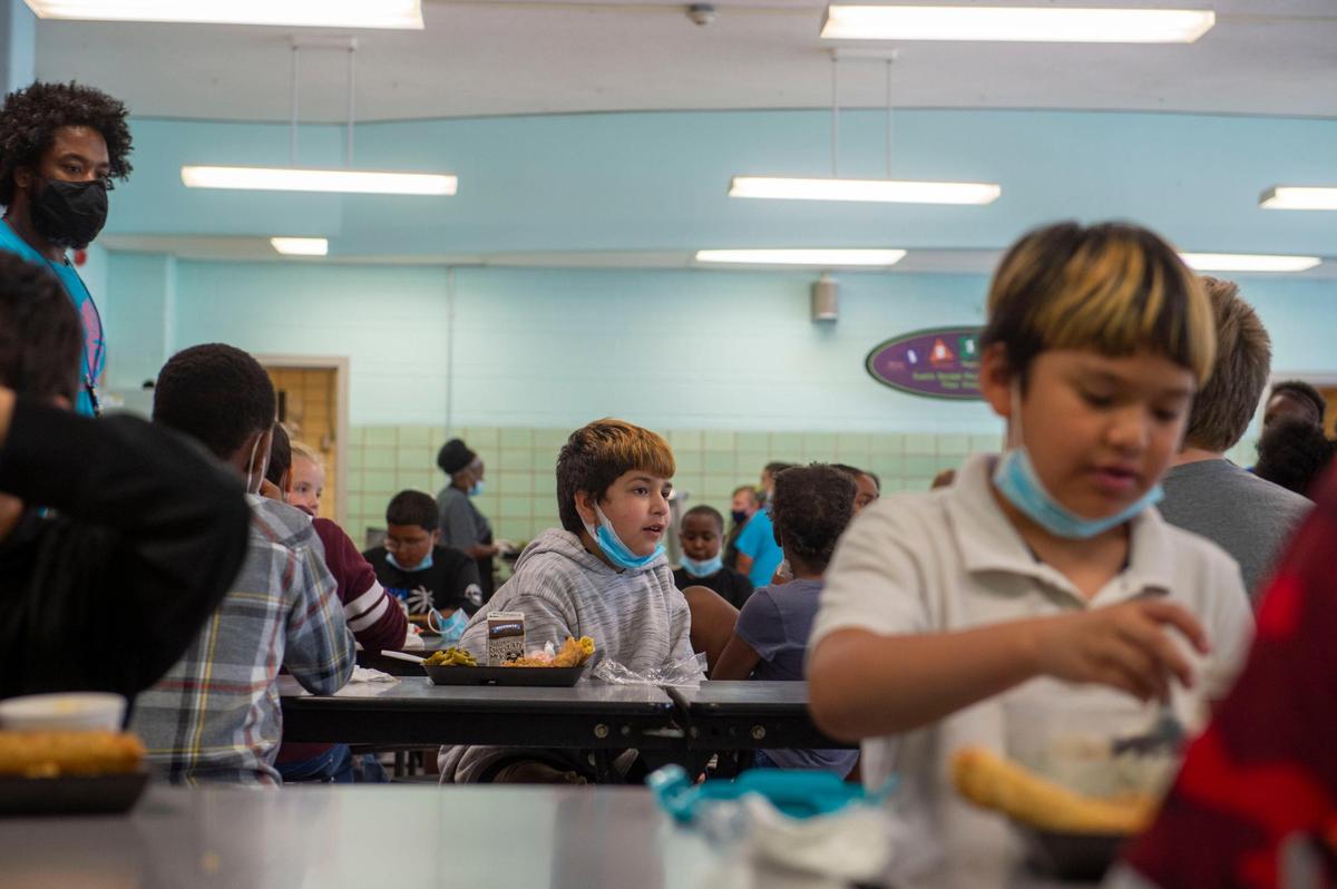 Kids eat lunch earlier this year at Phillis Wheatley Elementary School in Kansas City. Missouri Attorney General Eric Schmitt is seeking to empower parents to let their children disregard mask orders.