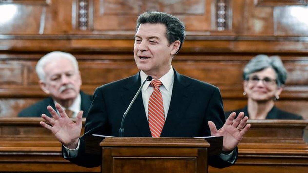 
Kansas Gov. Sam Brownback proposed a slowdown in income tax cuts — plus massive tax increases on tobacco and liquor — as part of his plans to fix a budget shortfall projected at $648 million for the next fiscal year.
