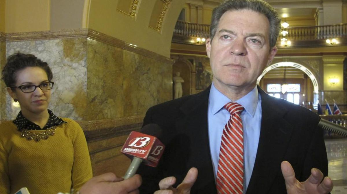 Kansas Gov. Sam Brownback answered questions from the media on Wednesday at the Statehouse in Topeka.