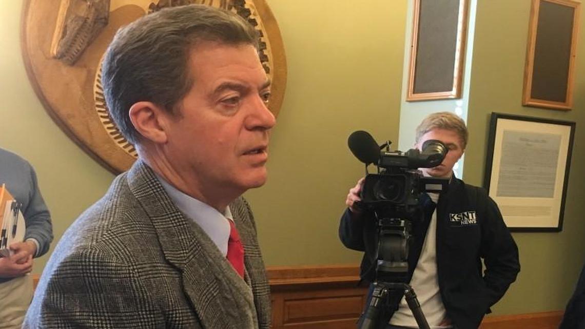 Kansas Gov. Sam Brownback talked to reporters Wednesday in Topeka.