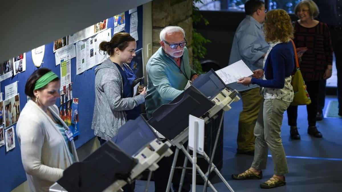 During the Missouri presidential primary in March, David Beebe, the supervisor election judge at United Methodist Church, showed voters how to use the electronic voting booths. Most people in charge of voting places say they’ve seen little to no evidence of voter fraud.