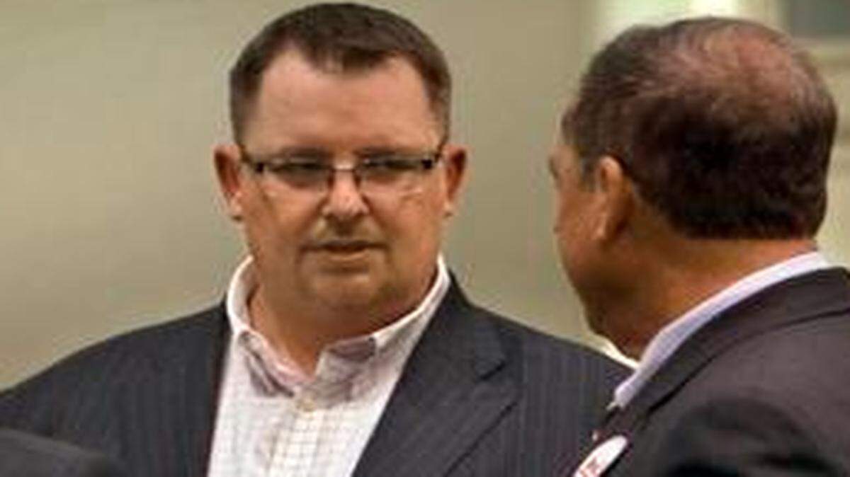 
Political consultants Steve Glorioso (left) and Jeff Roe (second from right) talk with supporters of a failed tax hike measure last year. 
