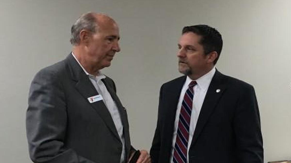 David Byrd (left), the CEO of the Greater Kansas City YMCA, talked to Unified Government Mayor Mark Holland before a planning meeting Thursday. Byrd said the YMCA has raised $11.5 million for a $16 million community center to be paired with a downtown grocery store to create a “healthy campus.”