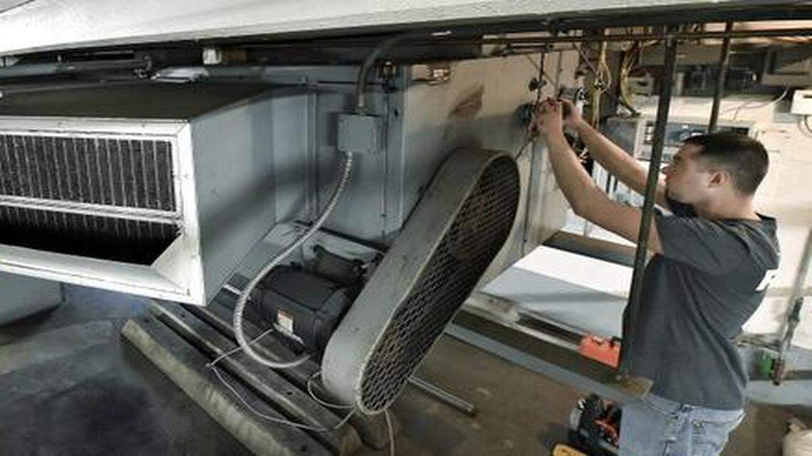 
Matt Hanschu of Firelake Construction in Lenexa worked recently on a newly installed control system for a heating unit in the garage of the Wornall Plaza building, 310 W. 49th St. in Kansas City. The building was undergoing energy upgrades.
