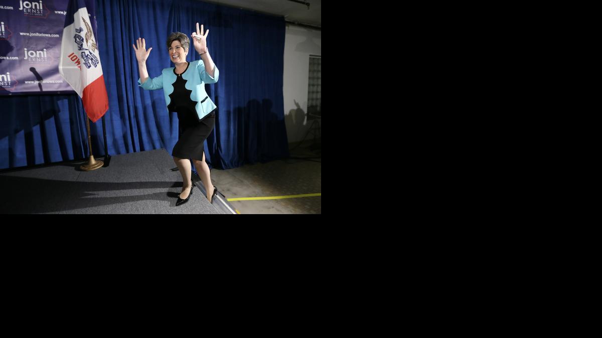 
Iowa State Sen. Joni Ernst waves to supporters at a primary election night rally after winning the Republican nomination for the U.S. Senate in Des Moines, Iowa.
