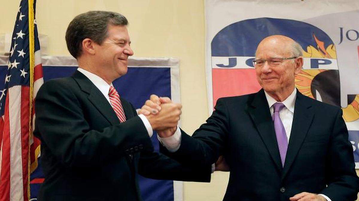 
Kansas Gov. Sam Brownback (left) and U.S. Sen. Pat Roberts both are facing difficult re-election campaigns this fall, but a variety of circumstances have kept their campaigns separate. They saw each other at Johnson County Republican election watch party on Aug. 5 in Overland Park.
