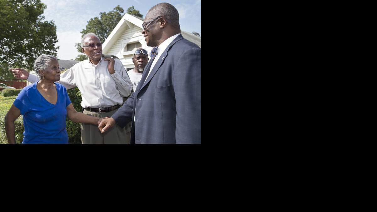 
Kansas City Mayor Sly James (right) spoke with Geraldine Scott (left) and Alvin Brooks after pushing for a sustained open carry ban.
