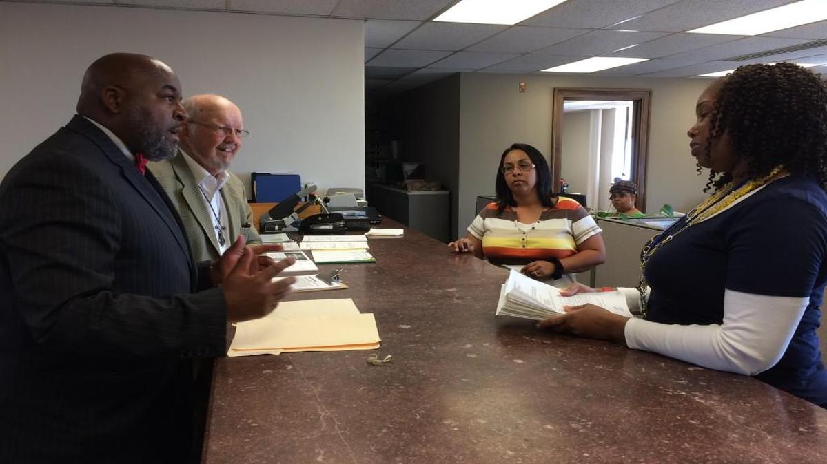 East Side advocates have a petition initiative they want on the April ballot, but a City Council committee postponed a decision on that plan Wednesday. Vernon Howard (left) and Sam Mann turned in petition signatures to city staff in October.