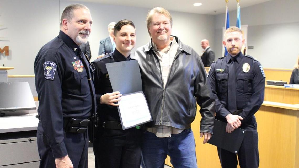 Merriam Chief of Police Michael Daniels (far left) and Officer Kristin Hannabass (second to left) posed with Terry Spruk (second to right) and Officer Colin Brown (far right) after Hannabass received a Lifesaving Award on Monday, Jan. 22, 2018, at a Merriam City Council meeting.