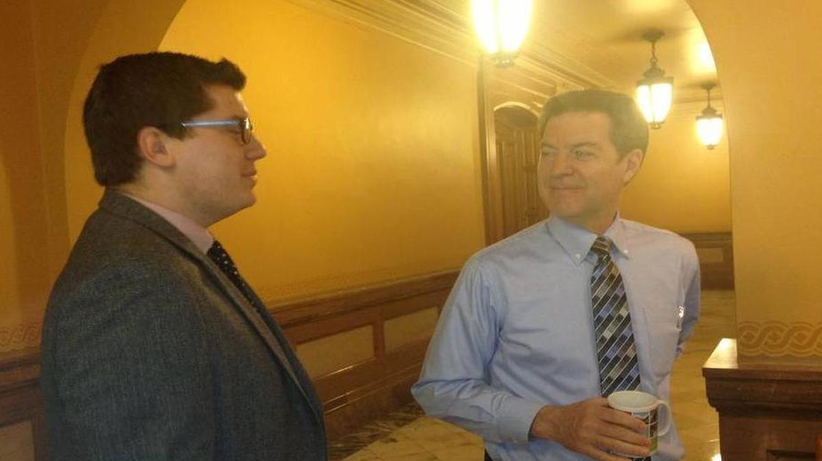 
Gov. Sam Brownback, right, talks with state Sen. Jacob LaTurner, a Pittsburg Republican, in the Capitol on Monday.
