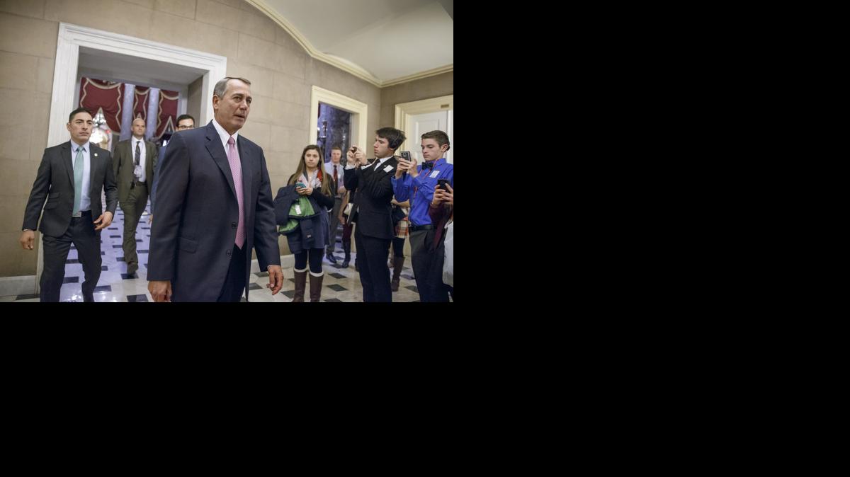 
House Speaker John Boehner of Ohio returns to his office on Capitol Hill in Washington, Tuesday, as the House votes on funding for the Homeland Security Department 
