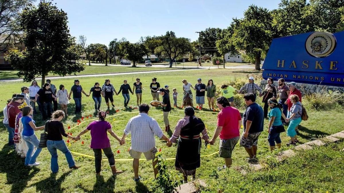 
Days after marching from Haskell Indian Nations University to Lawrence City Hall, students, faculty and community representatives celebrated Indigenous Peoples Day on Oct. 12 with a round dance. Students earlier had persuaded city officials to rename Columbus Day to honor the contributions of indigenous people, joining several other U.S. cities that have renamed the holiday.

