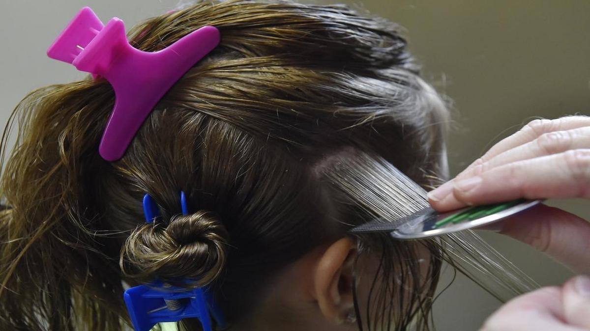 
Head lice infestations can be exasperating to parents and upsetting to children. This young customer was treated for head lice Wednesday by Alyssa Daniel at Combers KC in Overland Park.
