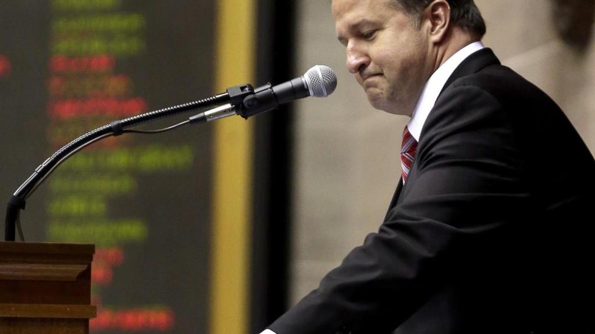 FILE - In this May 15, 2015 file photo, Missouri Republican House Speaker John Diehl, who acknowledged exchanging sexually suggestive text messages with a Capitol intern, addresses the body for the final time before resigning