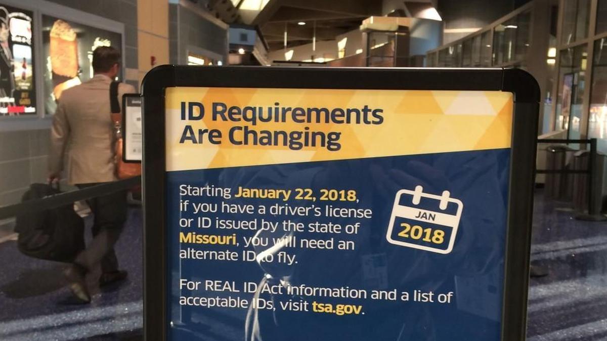 Signs posted at KCI airport warn Missouri passengers about future changes in identification requirements.