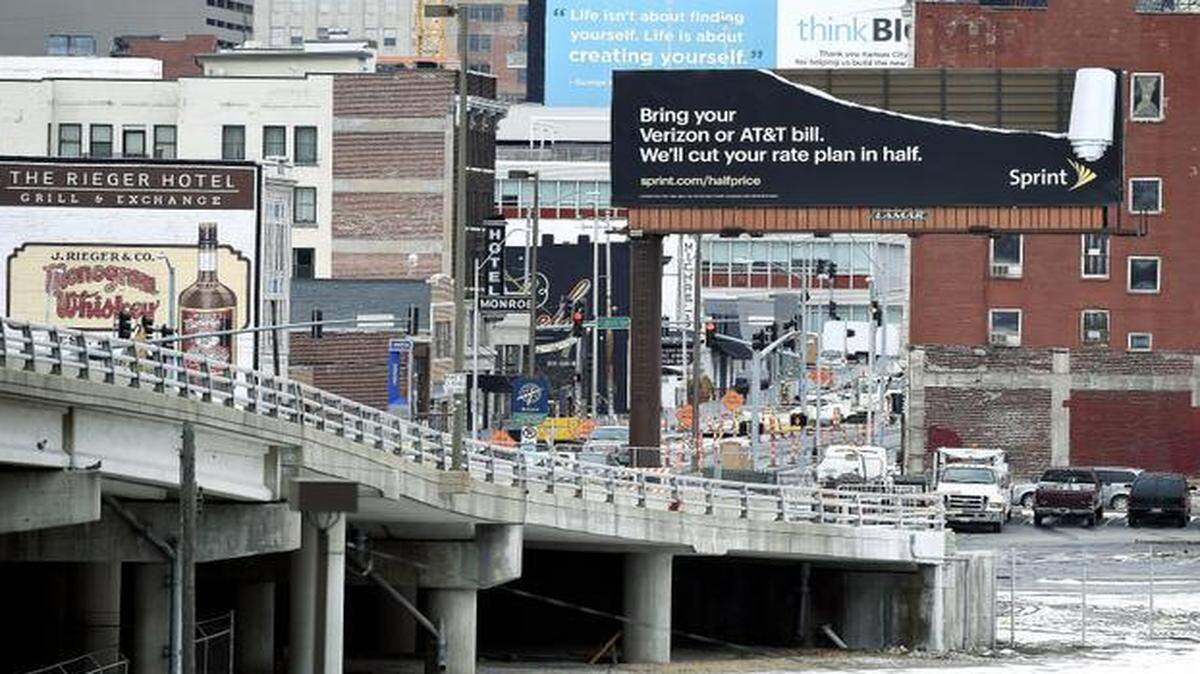 
This billboard at 20th and Main streets (seen Thursday) at the entrance to the Crossroads district had been a sign of contention between the city of Kansas City and an advertising company. The City Council has voted to settle a lawsuit by the Lamar advertising company, which had challenged the city’s powers to condemn its billboard. The city argued the sign was a hindrance to beneficial development; Lamar contended that its property rights were at stake.
