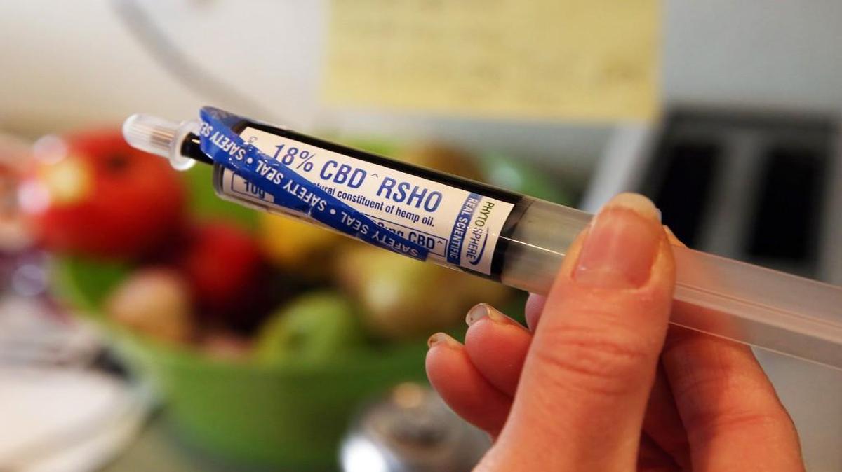Colorado law allows treating severely ill children with medication such as this oral-administration syringe loaded with high-cannabidiol hemp oil. A bill in the Legislature would allow similar medication to be used in Kansas to treat seizures.