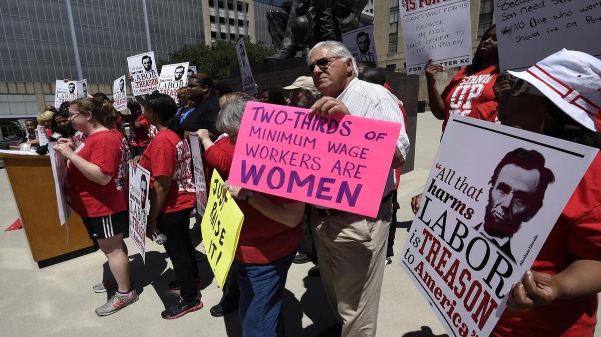 
About 40 supporters, including fast-food workers and local faith leaders, gathered earlier this summer at City Hall to push for a higher minimum wage.
