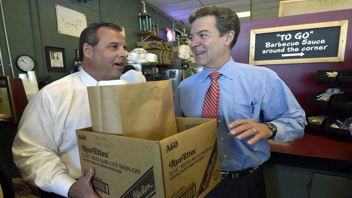 
New Jersey Gov. Chris Christie and Kansas Gov. Sam Brownback picked up an order to go Wednesday at Oklahoma Joe’s in Kansas City, Kan.
