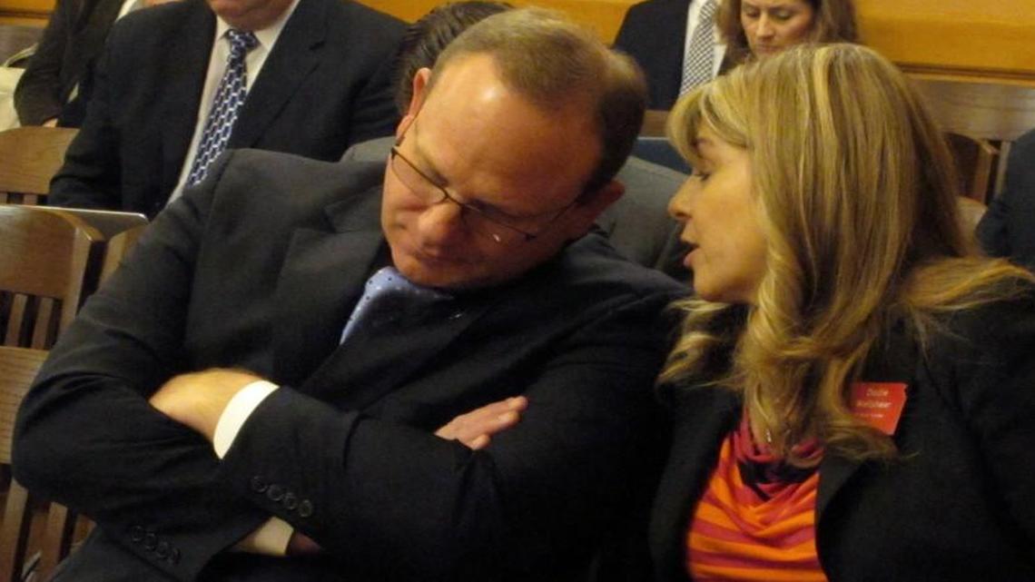 Todd White, the incoming superintendent of the Blue Valley School District, conferred with the district’s lobbyist, Dodie Wellshear, during a Senate Ways and Means Committee hearing on a new school funding plan Wednesday at the Statehouse in Topeka. White supports the plan because in redistributing state dollars, it ensures that no district loses state aid.
