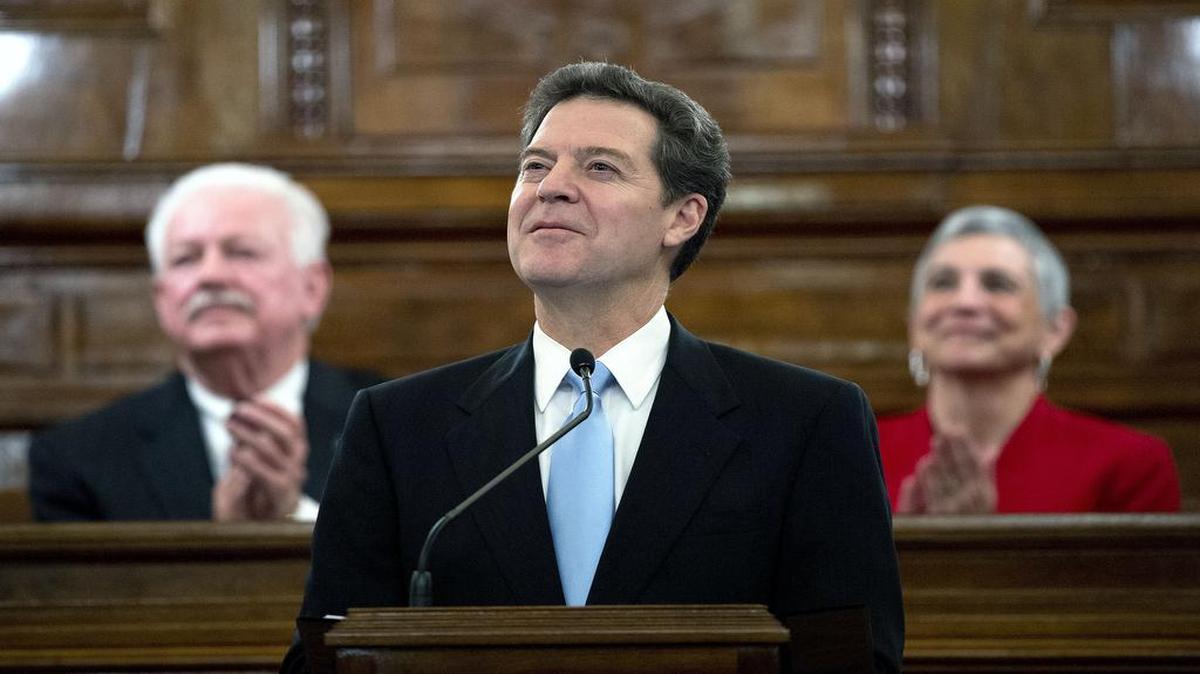 
Gov. Sam Brownback was flanked by House Speaker Ray Merrick and Senate President Susan Wagle during the 2013 State of the State address in Topeka.
