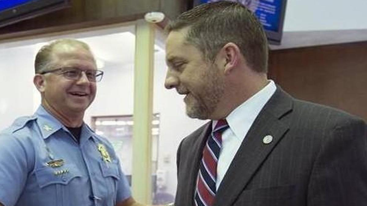 In Kansas City, Kan., Mayor Mark Holland (right) shook hands with Police Chief Terry Zeigler last month during a brief encounter at Police Headquarters.