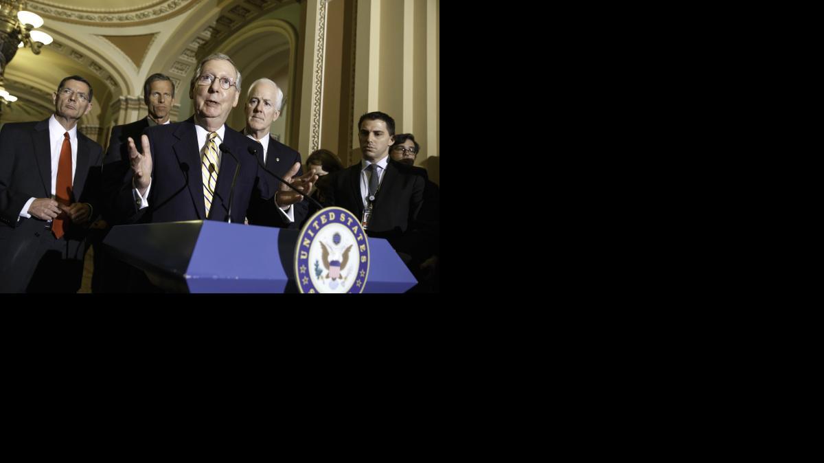 
Senate Minority Leader Mitch McConnell of Ky., center, talks to reporters about competing bills from the Democrats and Republicans on employee health coverage and birth control under the Affordable Care Act.
