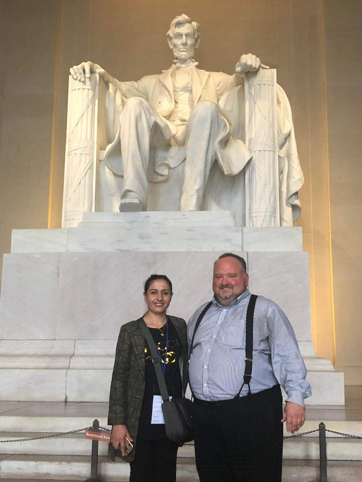 Zamzama Safi and Kyle Wilkens stand next to the Lincoln Memorial in Washington, D.C. Safi was evacuated from Afghanistan after assistance from Missouri Rep. Emanuel Cleaver’s office and Wilkens, who works in the office.