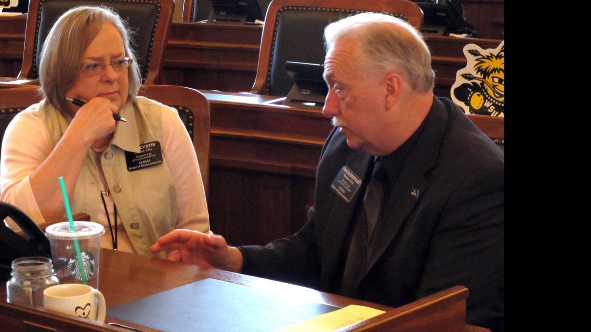 
Kansas state Rep. Pam Curtis, left, D-Kansas City, confers with House Minority Leader Tom Burroughs, right, D-Kansas City at the Statehouse in Topeka, Kan.
