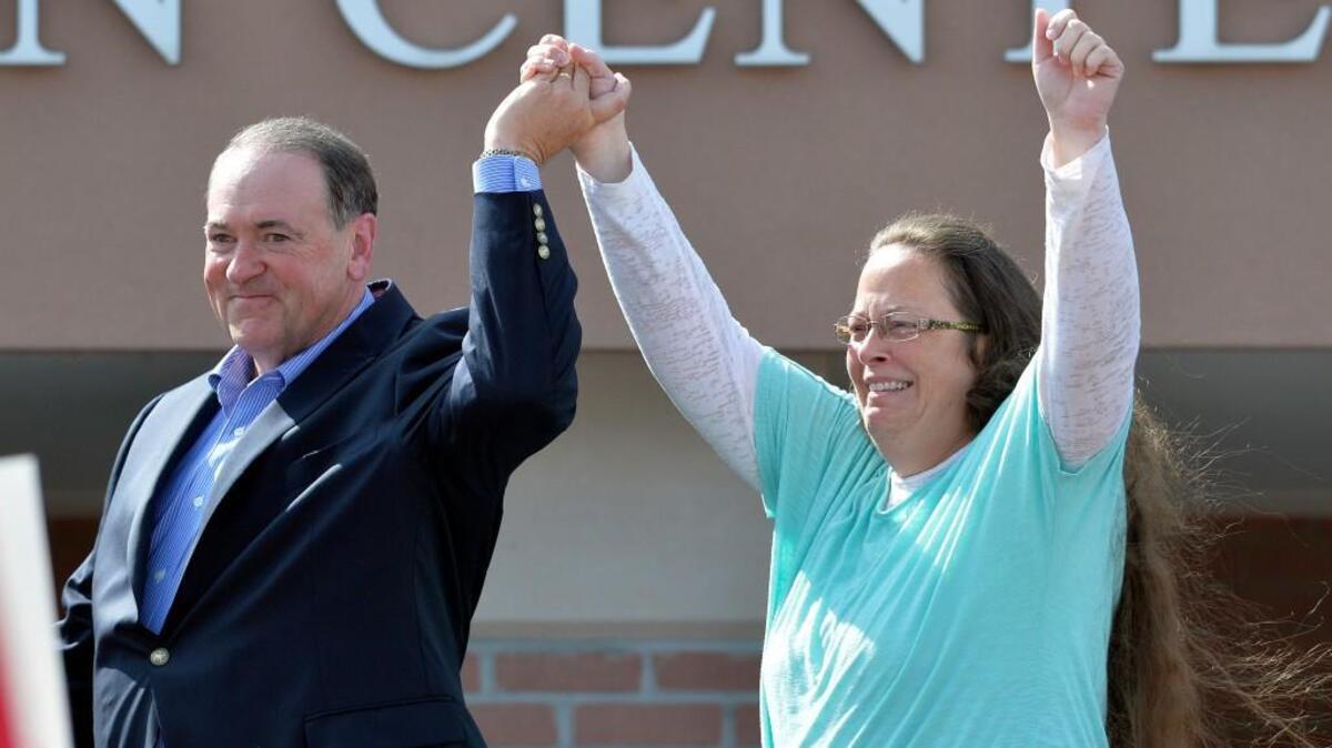 
Republican presidential candidate Mike Huckabee and Kim Davis
