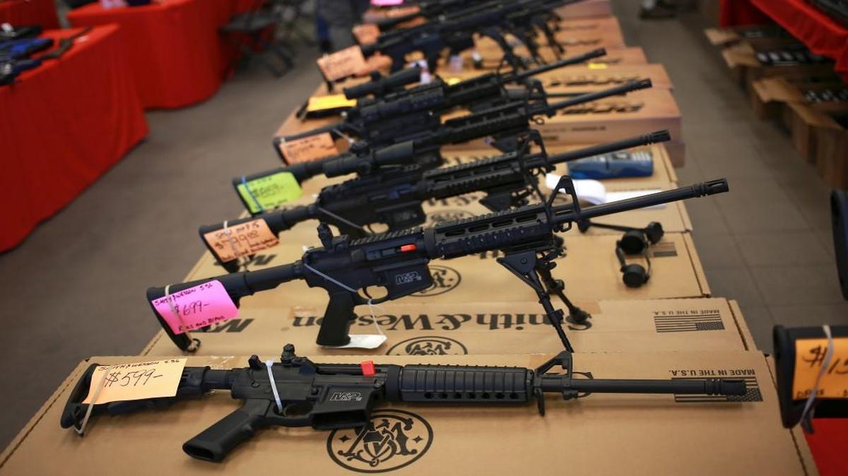 Smith & Wesson AR-15 rifles were available for sale at a 2014 gun show in Loveland, Colo. Voters in Maine and in Nevada on Tuesday are poised to approve background checks for almost all private sales and transfers of guns, including those at gun shows.