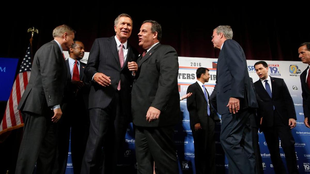 
Republican presidential candidates, from left, Lindsey Graham, Ben Carson, John Kasich, Chris Christie, Bobby Jindal, Jeb Bush, Scott Walker and Rick Santorum
