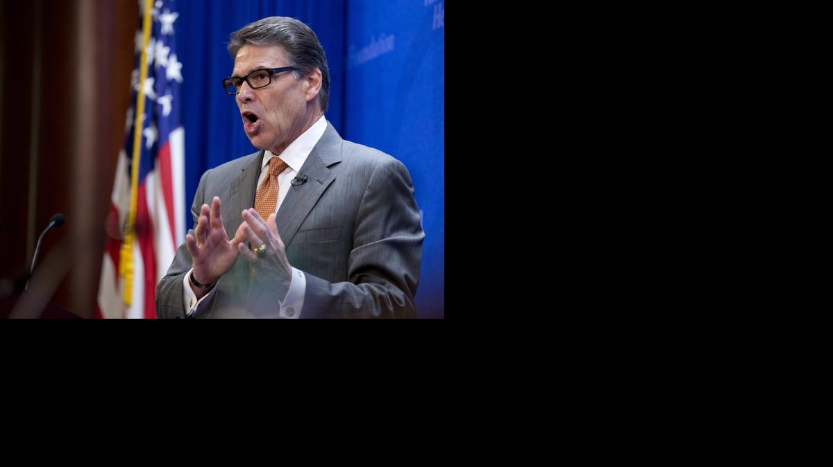 
Texas Gov. Rick Perry, speaks at the Heritage Foundation in Washington, Thursday, Aug. 21, 2014, saying he would be open to sending U.S. combat forces to Iraq
