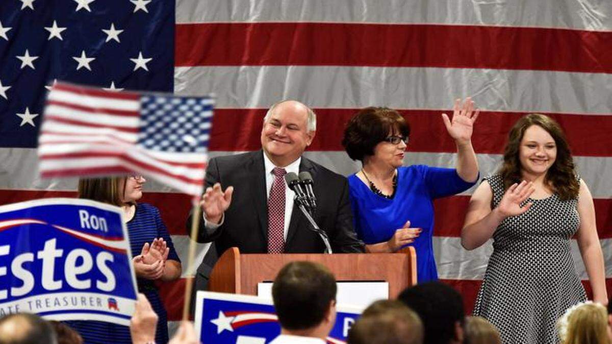 
Kansas State Treasurer Ron Estes took the podium to make his victory speech with his wife, Susan, and children, Laura and Grace, at Tuesday’s Republican election watch party in Topeka.
