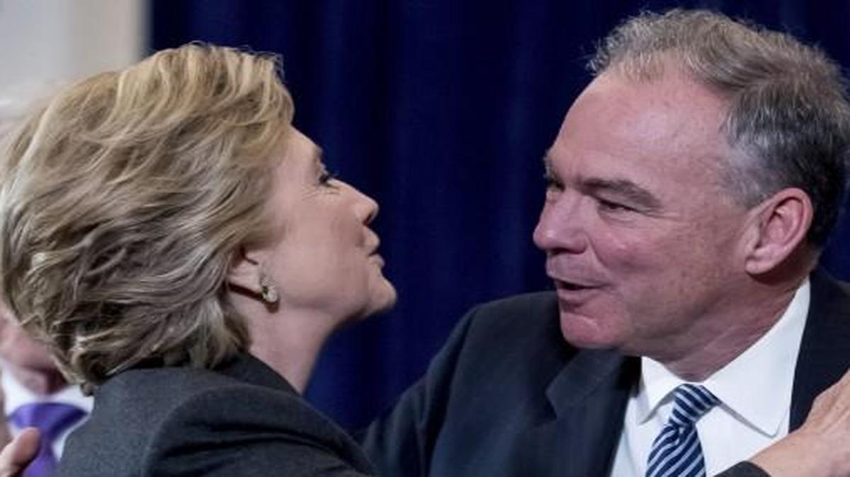 The day after the election, Democratic vice presidential candidate Tim Kaine was embraced by Hillary Clinton after speaking Wednesday morning. Kaine was accompanied by his wife, Anne Holton (right).