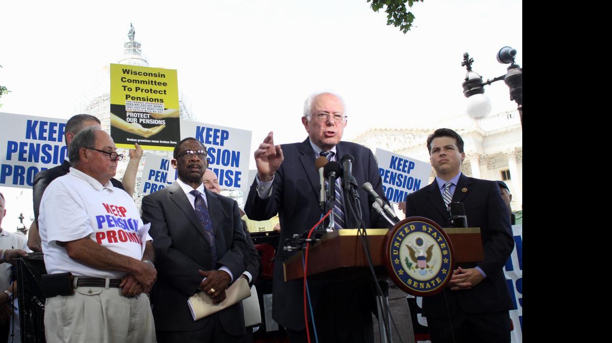
Democratic presidential candidate Sen. Bernie Sanders, I-Vt., accompanied by Rep. Brendan Boyle, D-Pa., right, and others, speak on labor issues Thursday in Washington.

