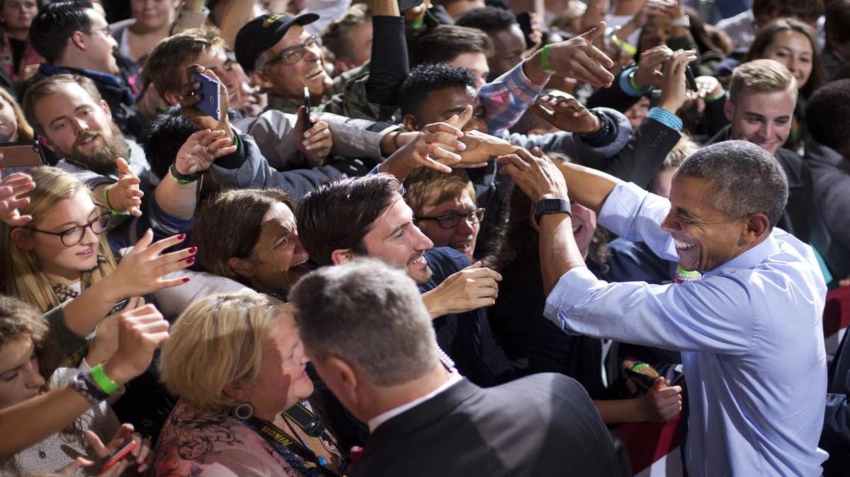 President Barack Obama shook hands with supporters at the University of New Hampshire Monday in Durham, N.H., during a campaign rally for Democratic presidential candidate Hillary Clinton.