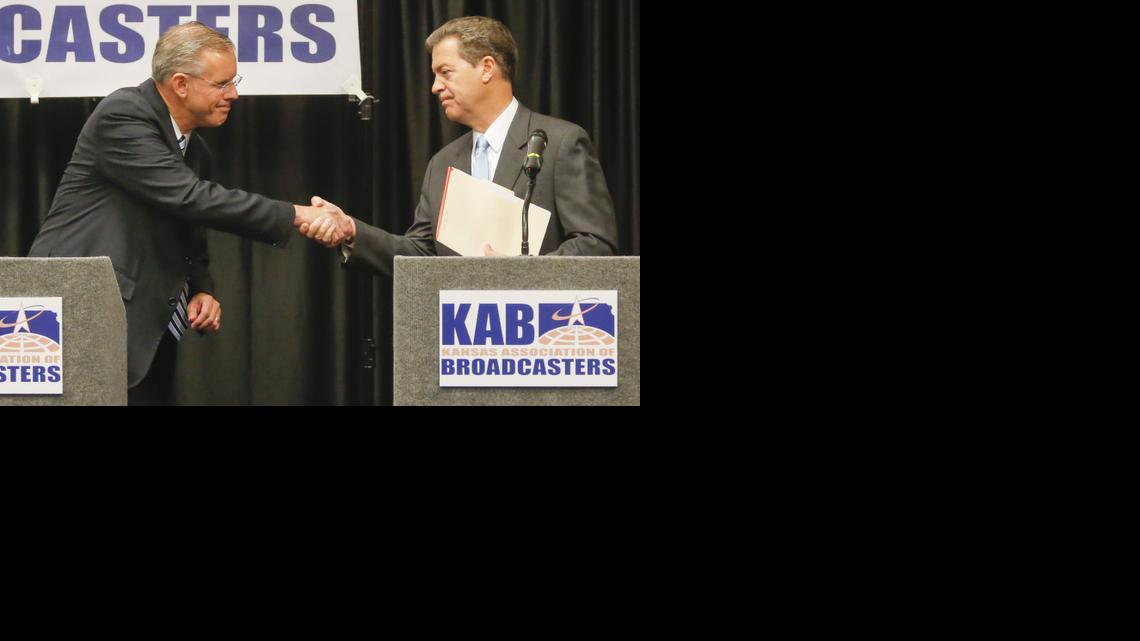 
Kansas gubernatorial candidates Paul Davis, left, and Sam Brownback 
