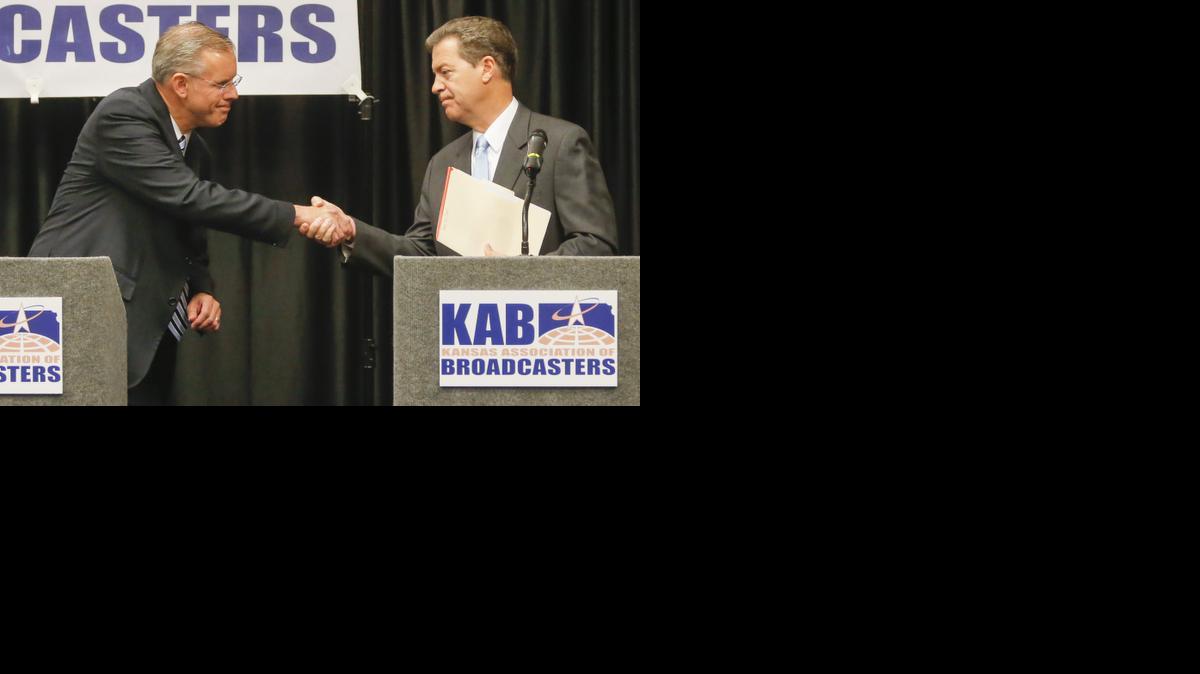 
Kansas gubernatorial candidates Paul Davis, left, and Sam Brownback 
