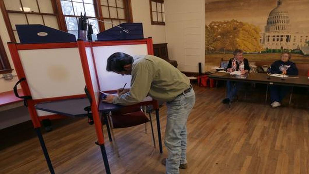 
Clay Sheldon votes in the midterm elections at the old Brown School Tuesday, Nov. 4, 2014, in Wellsville, Kansas.
