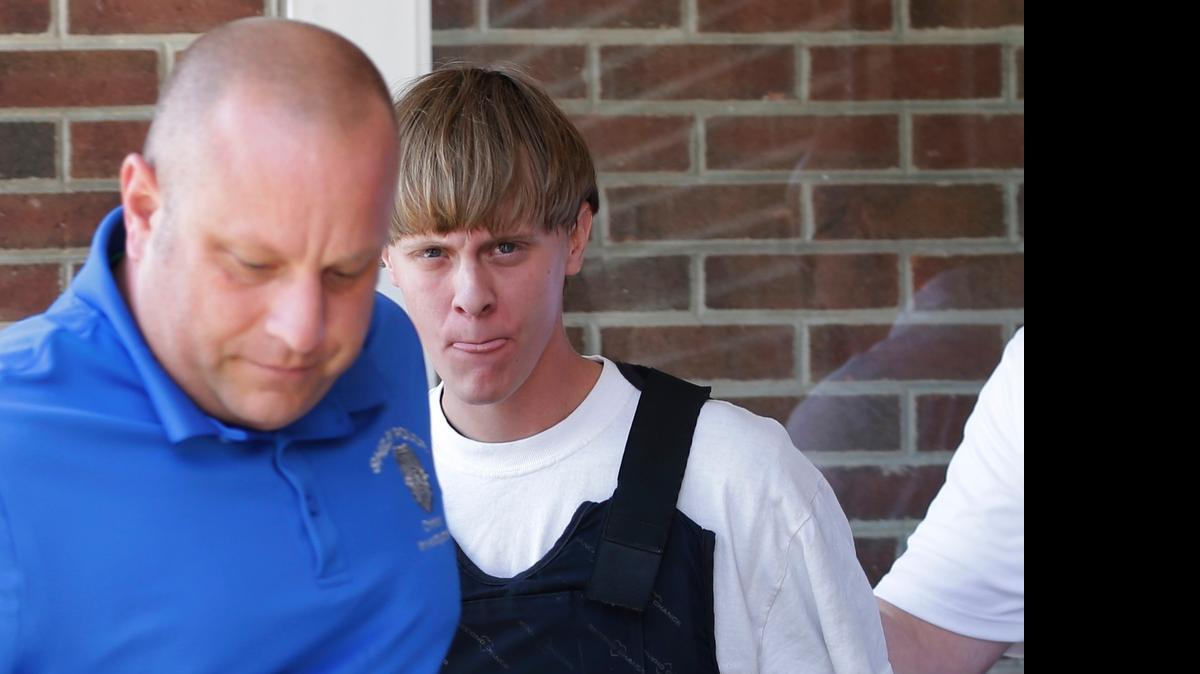 
Charleston, S.C., shooting suspect Dylann Storm Roof, center, is escorted from the Sheby Police Department in Shelby, N.C., late last week.
