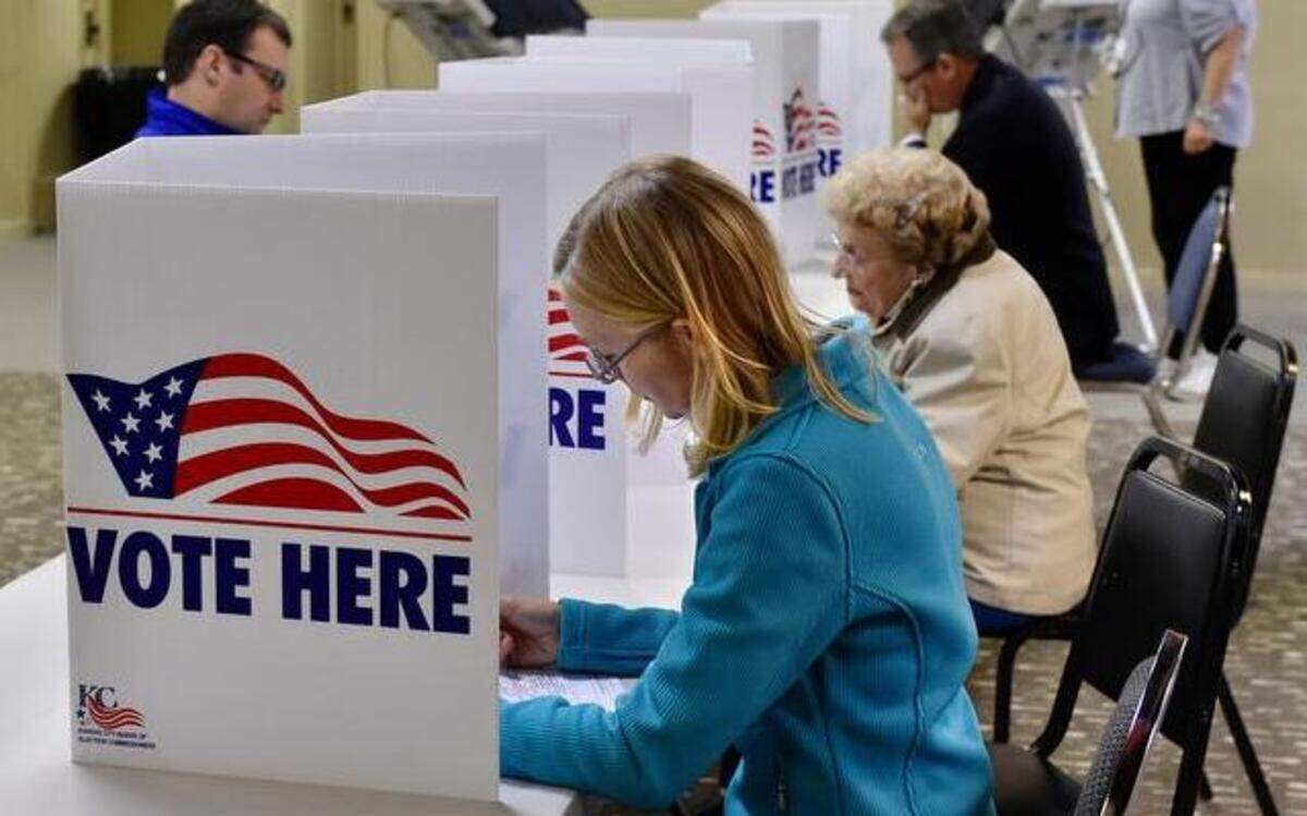 
The polling station at Wornall Road Baptist Church in Brookside received a steady stream of voters Tuesday afternoon, including Sharon Lester (foreground right), who voted after work.
