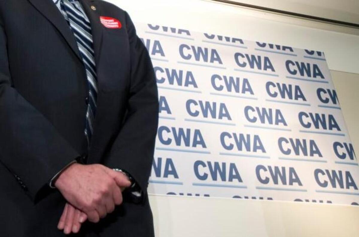 Democratic presidential candidate Sen. Bernie Sanders, I-Vt., stands in front of members of the Communication Workers of America (CWA) in Washington, Thursday