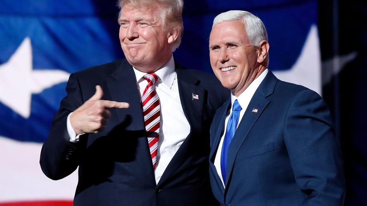 Republican presidential candidate Donald Trump, points toward Republican vice presidential candidate Indiana Gov. Mike Pence after Pence's acceptance speech during the third day session of the Republican National Convention in Cleveland, Wednesday, July 20, 2016.