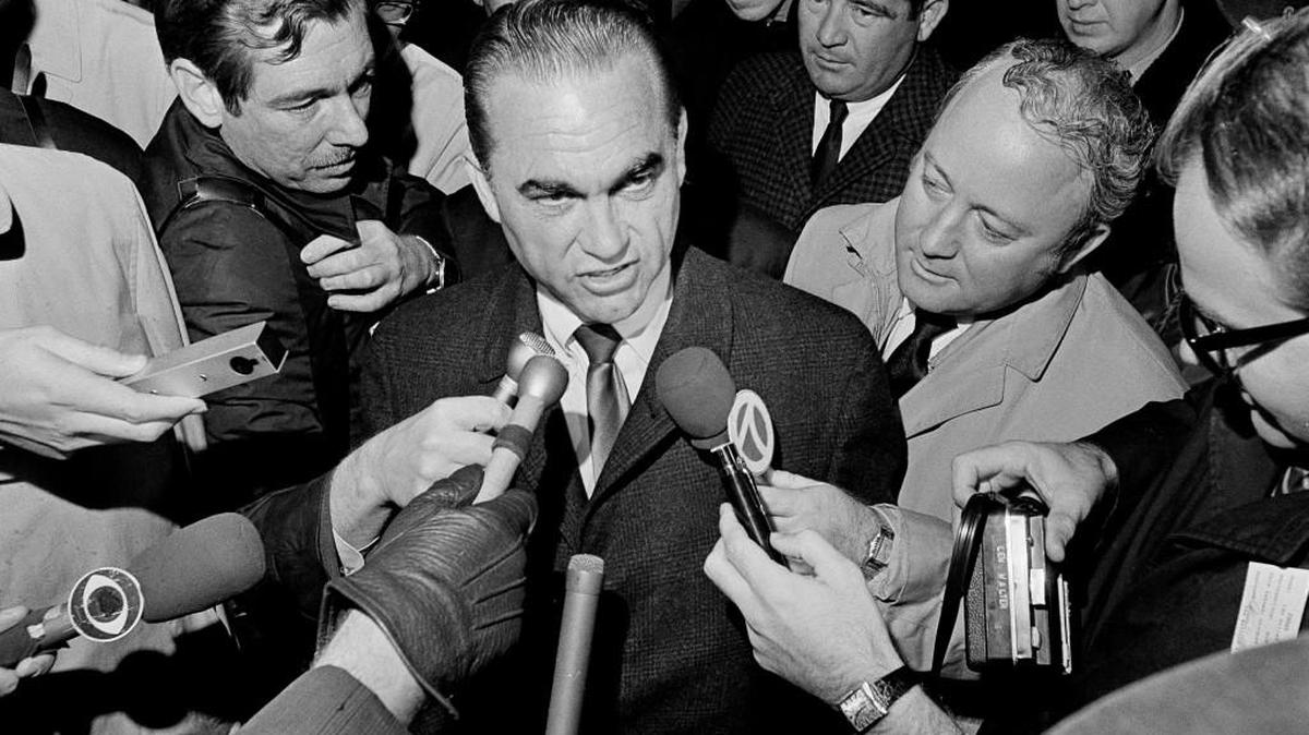 Reporters surround presidential candidate, former Alabama Gov. George Wallace in 1968 at Metro Airport in Detroit