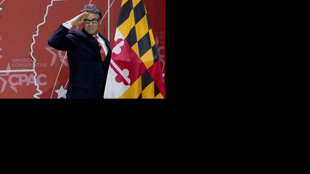 
Former Texas Gov. Rick Perry salutes as he leaves the stage after speaking during the Conservative Political Action Conference (CPAC) in National Harbor, Md., Friday.
