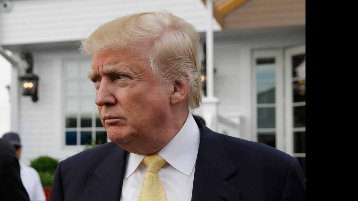 
Republican presidential candidate Donald Trump arrives to a fund raising event at a golf course in the Bronx borough of New York, Monday
